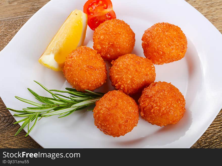 Hot juicy Cheese balls served rosemary branch