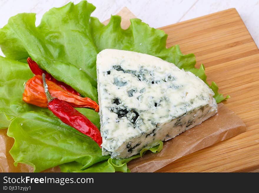 Roquefort cheese with pepper and salad leaves