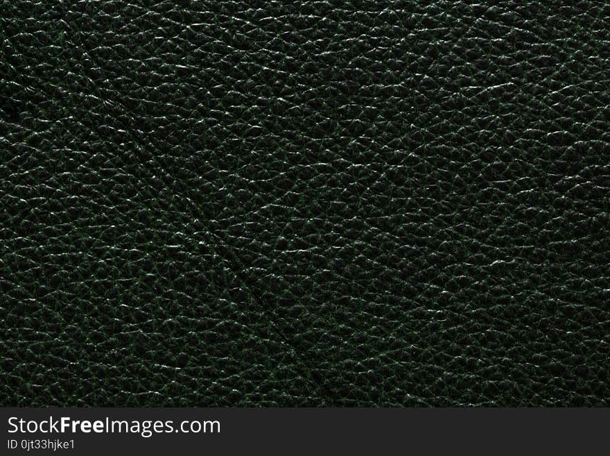 Perfective dark green leather texture. High resolution photo.