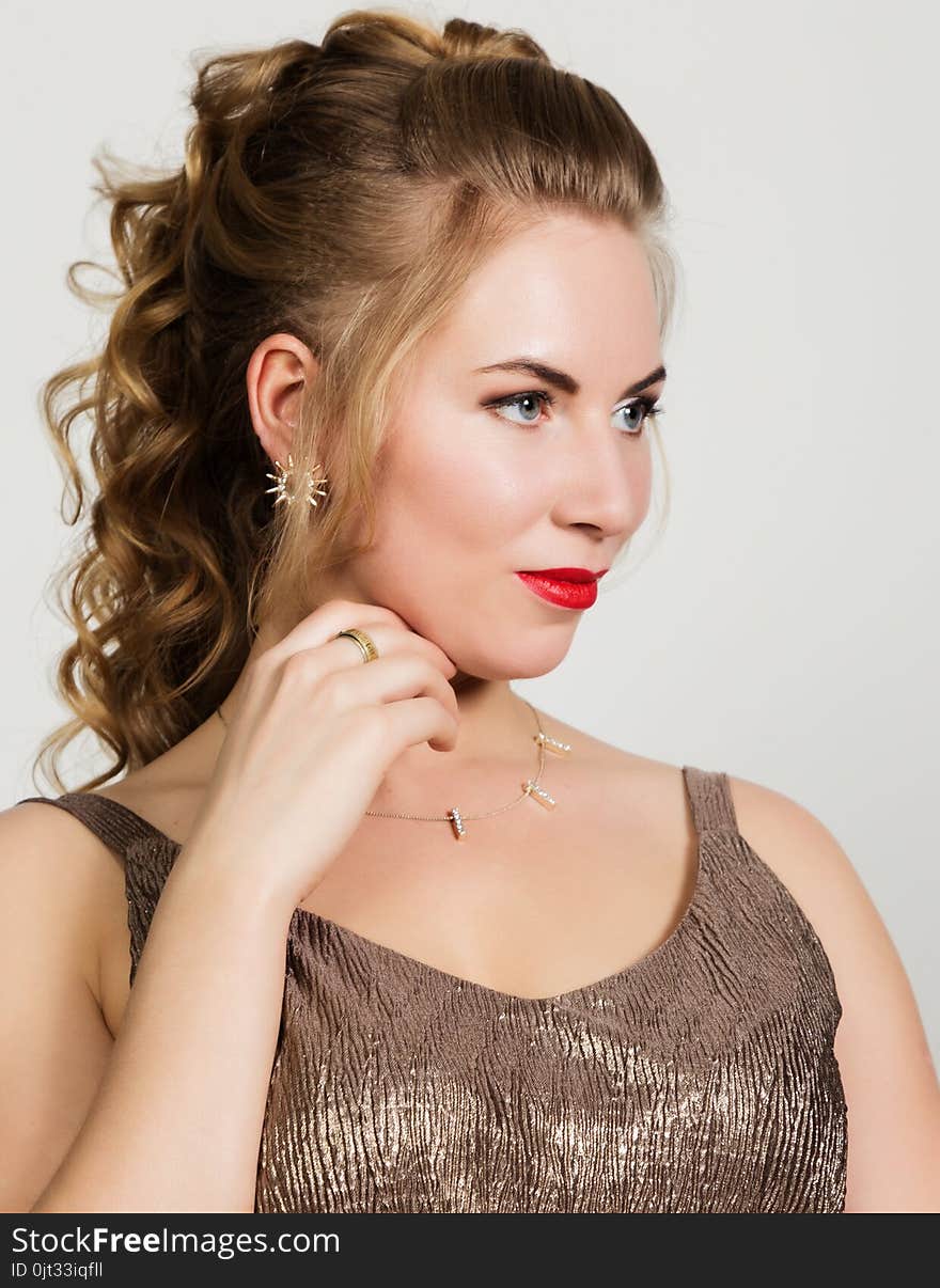 Beautiful curly woman with red lips portrait on a light background