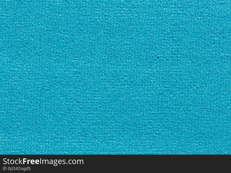 Shiny clean textile background in blue hue. High resolution photo.