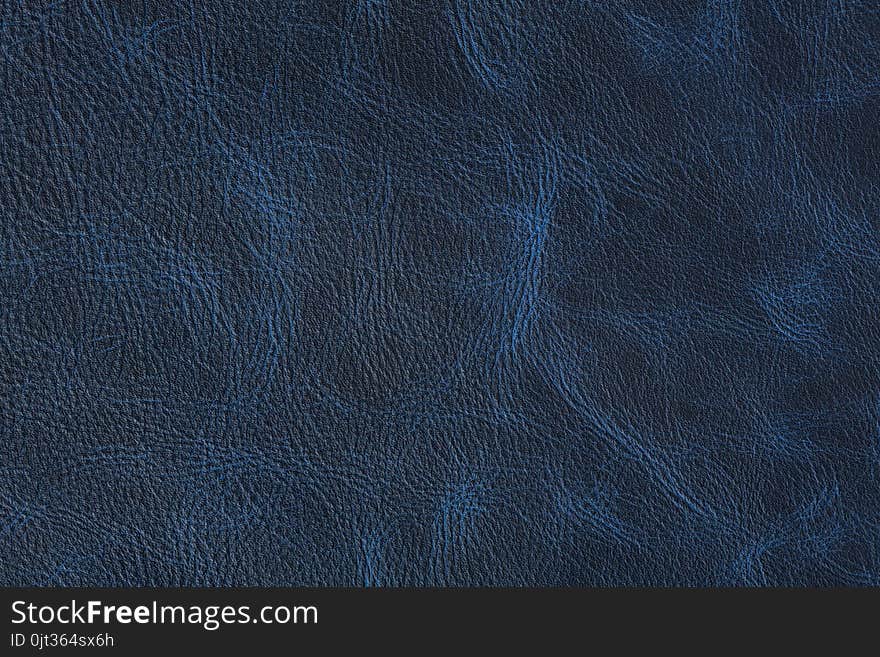 Texture of dark blue vintage leather on macro.