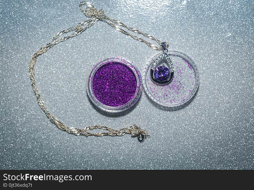 Fashion silver pendant with purple zirconia, amethyst imitation.