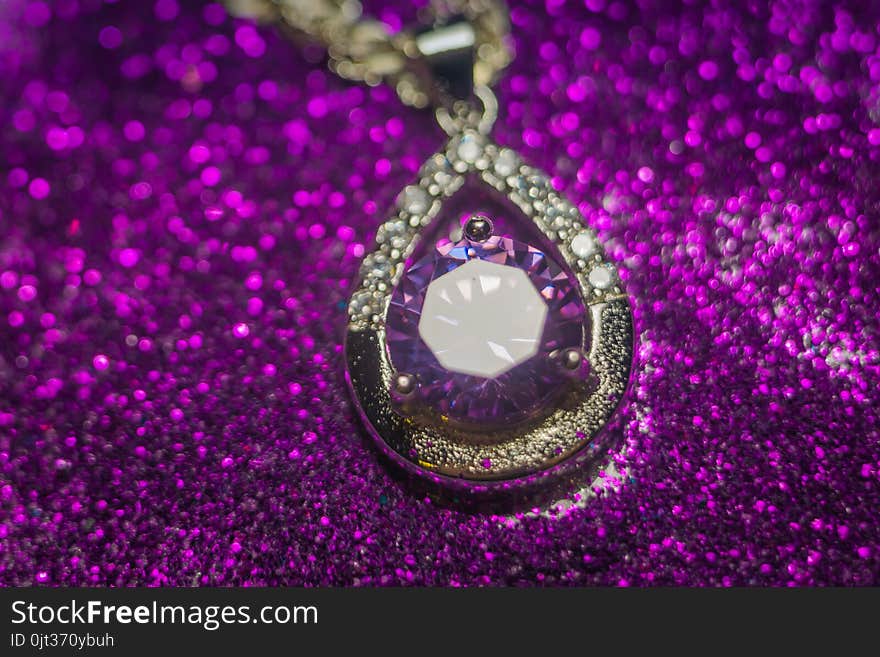 Fashion silver pendant with purple zirconia, amethyst imitation.