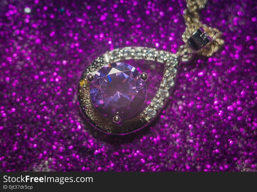 Fashion silver pendant with purple zirconia, amethyst imitation.