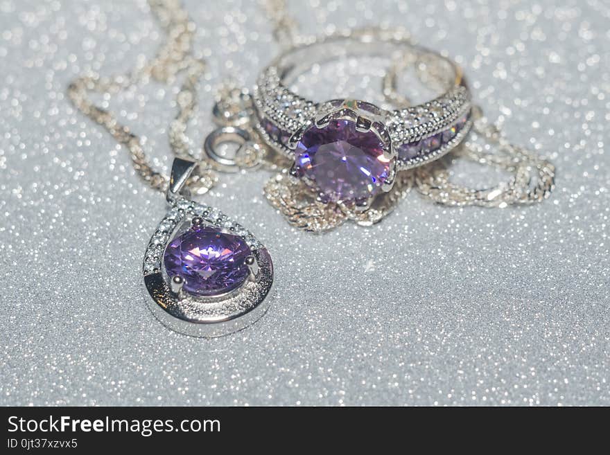 Fashion silver pendant with purple zirconia, amethyst imitation.