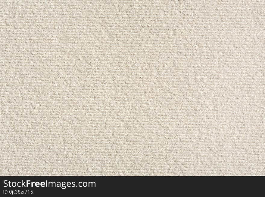 Cream textured wall.