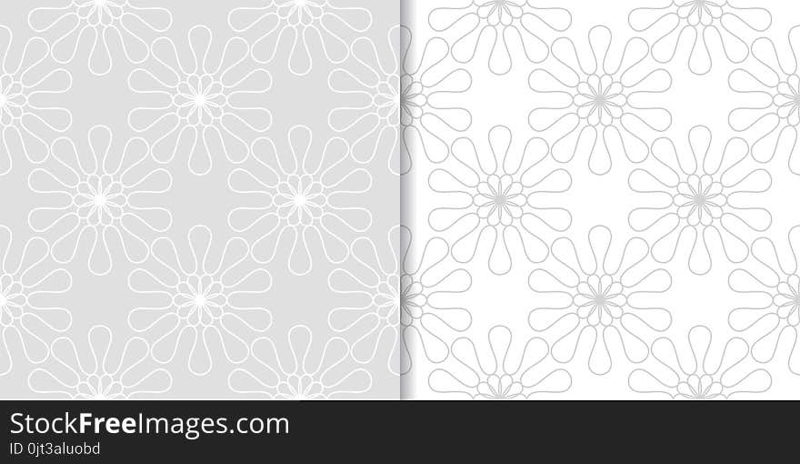 Light gray floral ornaments. Set of seamless patterns