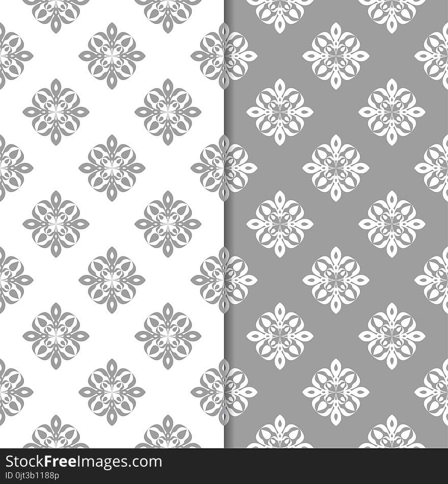 White and gray floral backgrounds. Set of seamless patterns