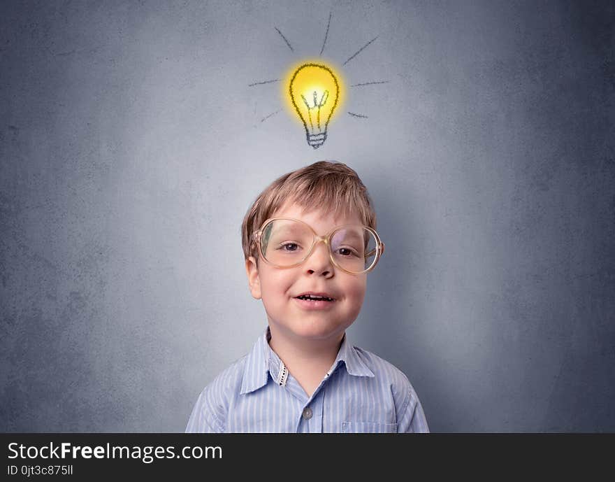 Little boy mull over with bulb above his head