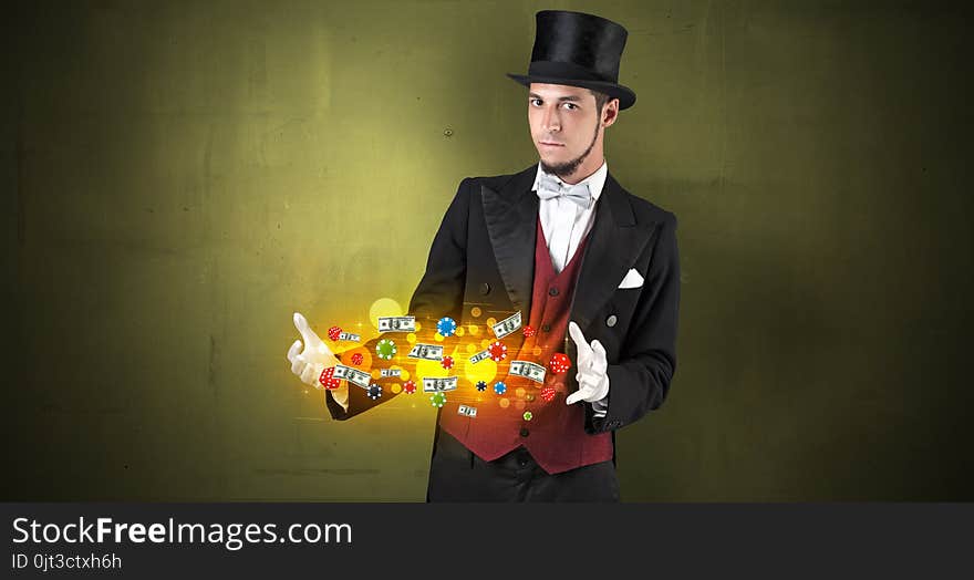 Illusionist conjure with his hand gambling staffs