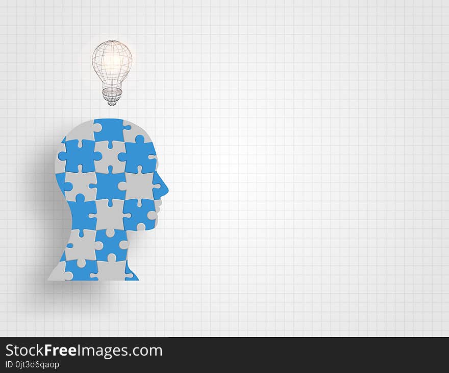 Lightbulb On Human Head Model That Filled With Jigsaw On Grid Background Represent Design Thinking And Innovation Concept.