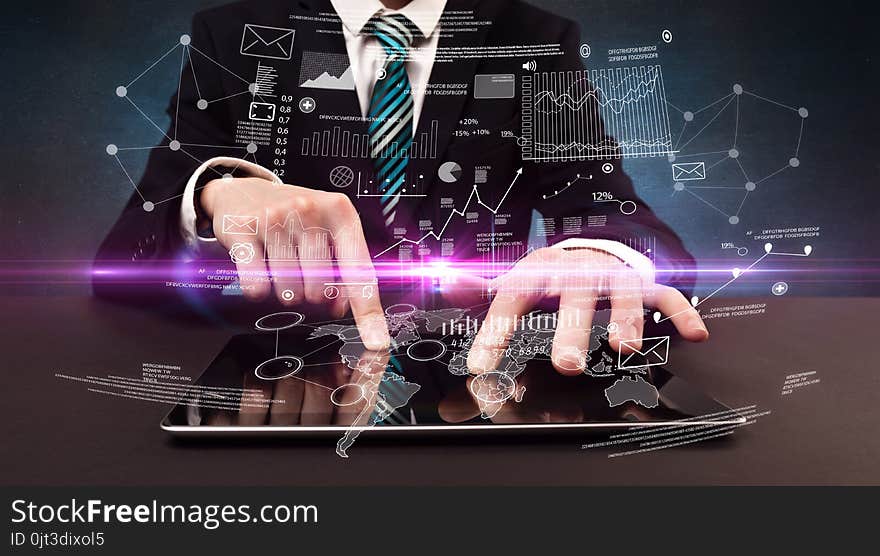 Businessman in formal attire typing with financial concept around. Businessman in formal attire typing with financial concept around