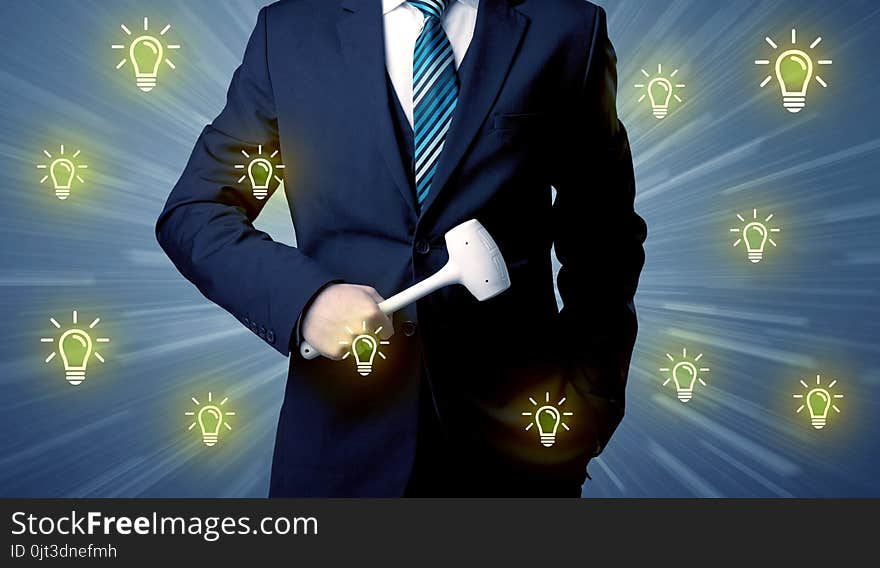 Better-looking businesman holding tool with idea bulbs concep. Better-looking businesman holding tool with idea bulbs concep