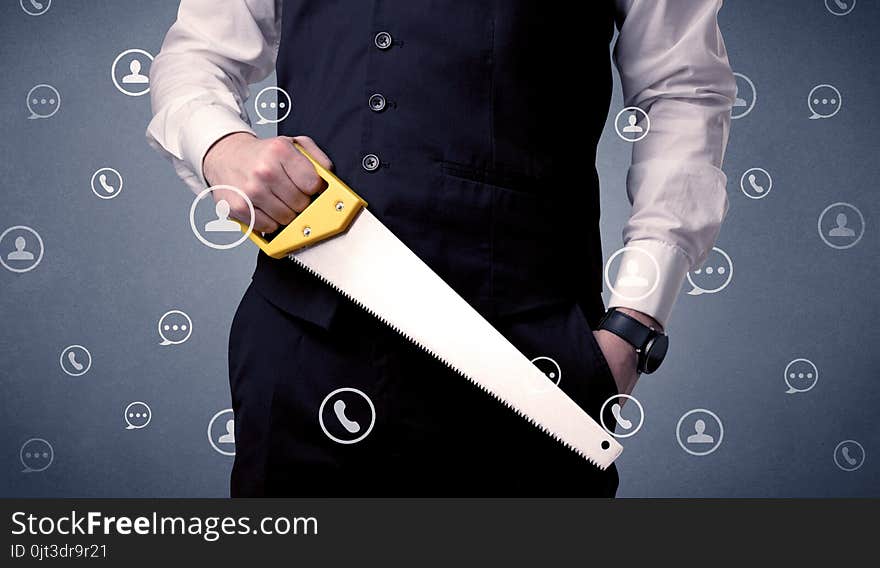 Thoughtful businesman holding tool with communication symbols around. Thoughtful businesman holding tool with communication symbols around