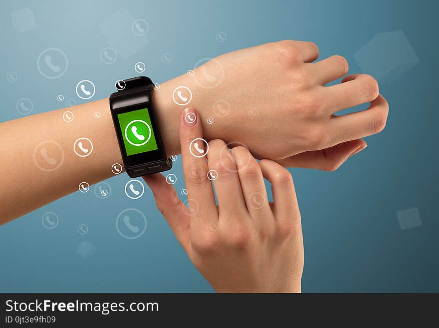 Hand with smartwatch and call icon around