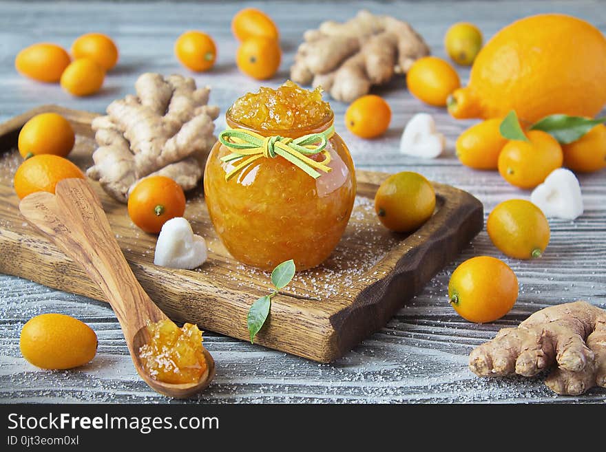 Homemade ginger, lemon and kumquat jam in a glass jar