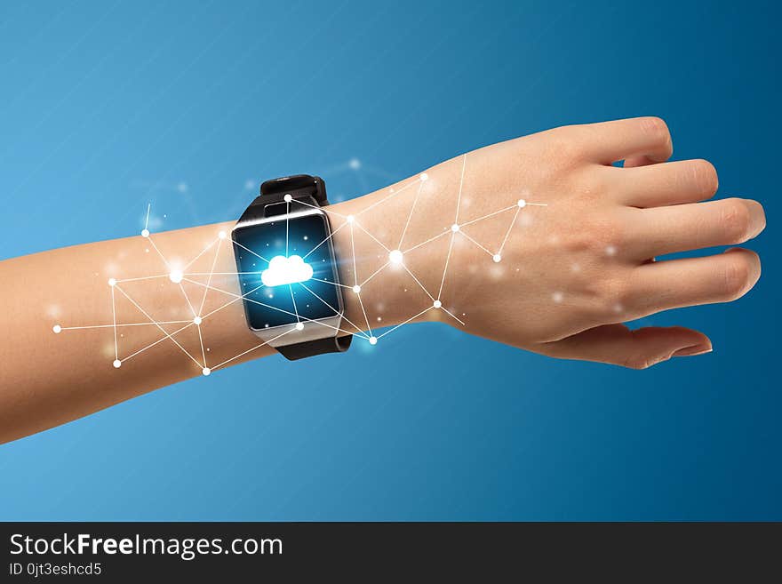 Naked female hand with smartwatch and with cloud technology and connection symbol. Naked female hand with smartwatch and with cloud technology and connection symbol