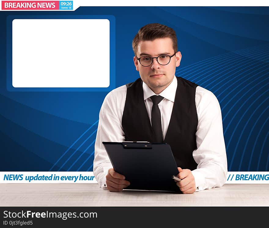 Television reporter telling breaking news at his studio desk with copy space concept