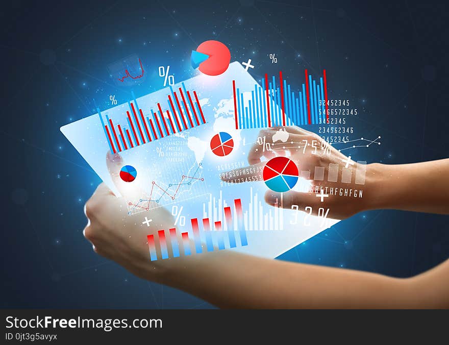 Hands Touching A Glass-like Tablet With Charts