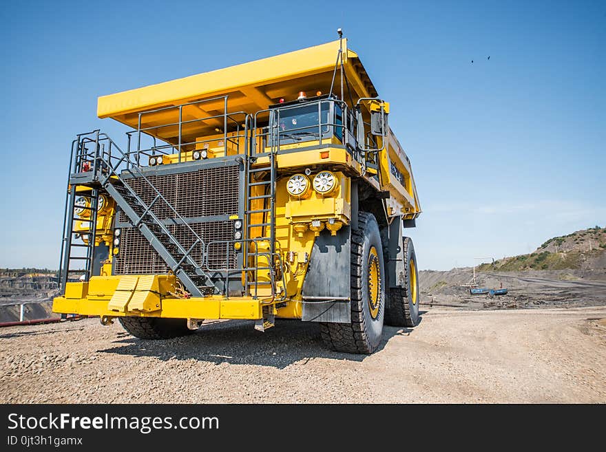 Big yellow mining truck at worksite