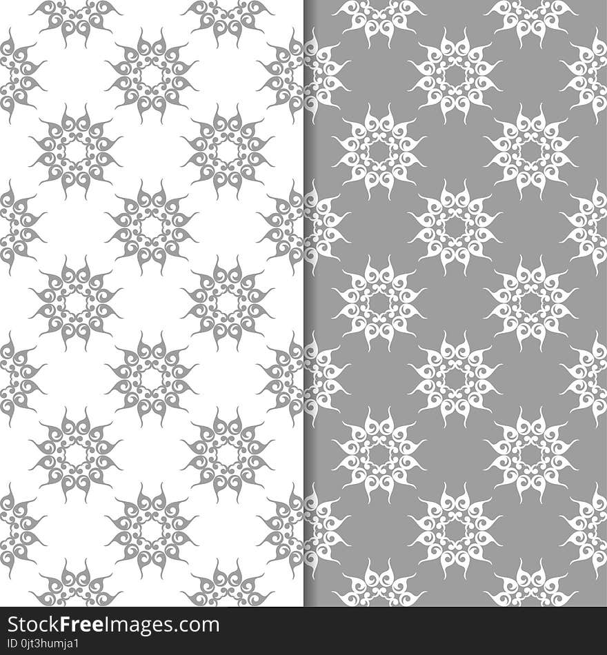 White and gray floral backgrounds. Set of seamless patterns for textile and wallpapers