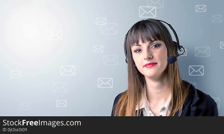 Young female telemarketer with white envelopes surrounding her