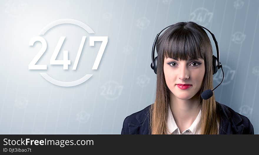 Young female telemarketer with a 24/7 sign next to her