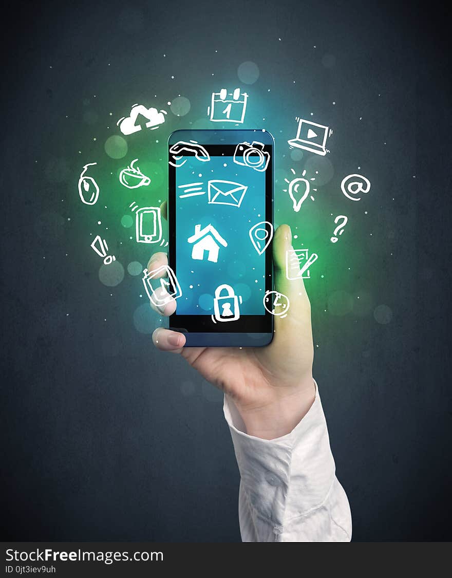 Caucasian hand in business suit holding a smartphone with drawn web icons. Caucasian hand in business suit holding a smartphone with drawn web icons