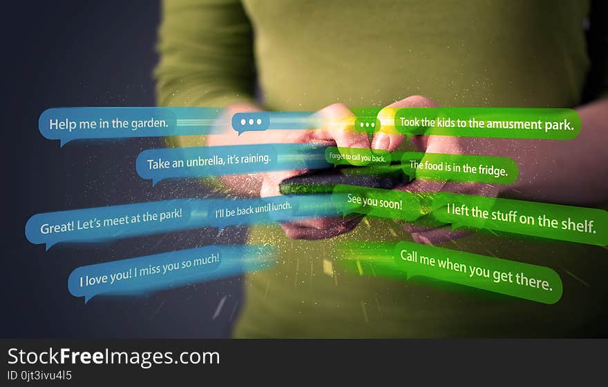 Young woman writing messages with smartphone application