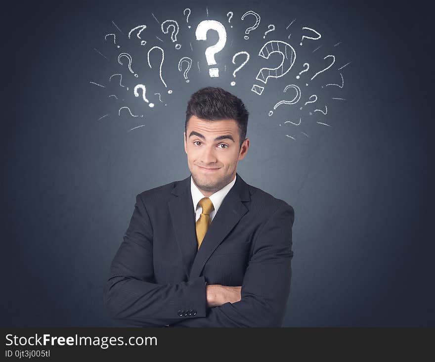 Young businessman with white question marks above his head. Young businessman with white question marks above his head