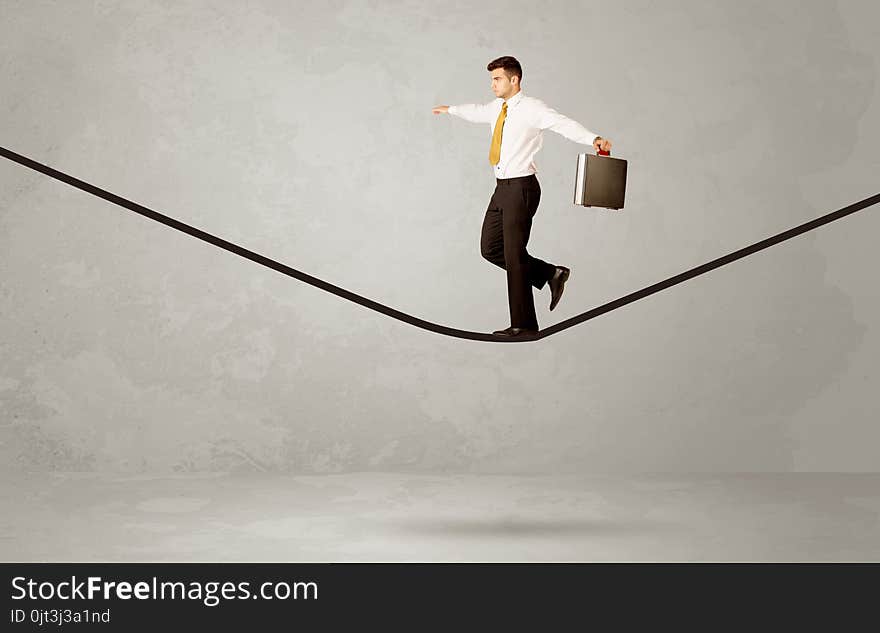 Salesman Walking On Rope In Grey Space