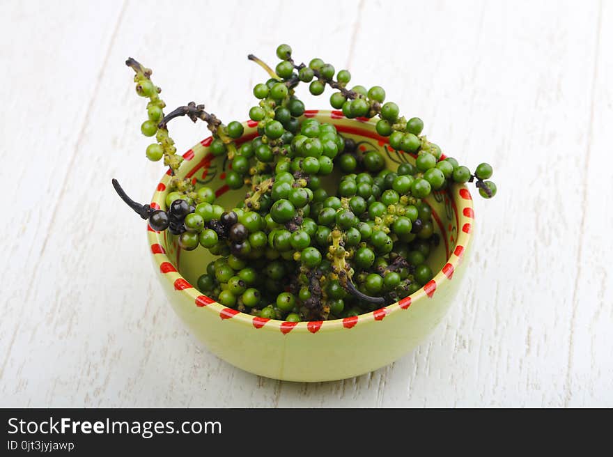 Green pepper corn on the branch in plate