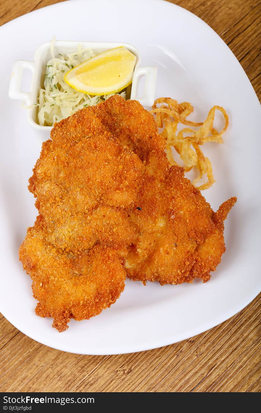 Czech cuisine - schnitzel with cabbage and lemon