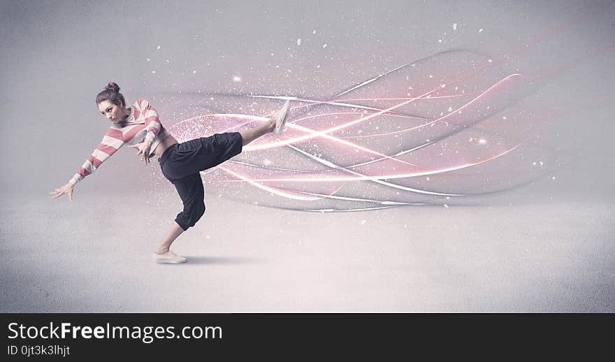 A pretty hip hop dancer dancing contemporary dance illustrated with glowing motion lines in the background concept. A pretty hip hop dancer dancing contemporary dance illustrated with glowing motion lines in the background concept.