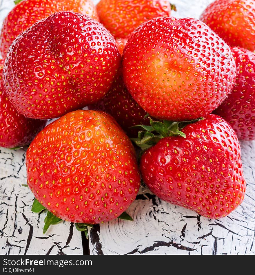 Sweet and fresh strawberry on white background. Natural food. Square. Close-up.