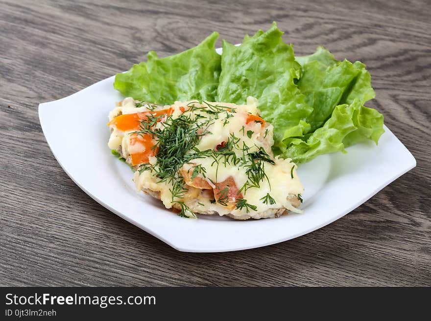 Meat covered cheese, mushrooms, dill and tomato. Meat covered cheese, mushrooms, dill and tomato