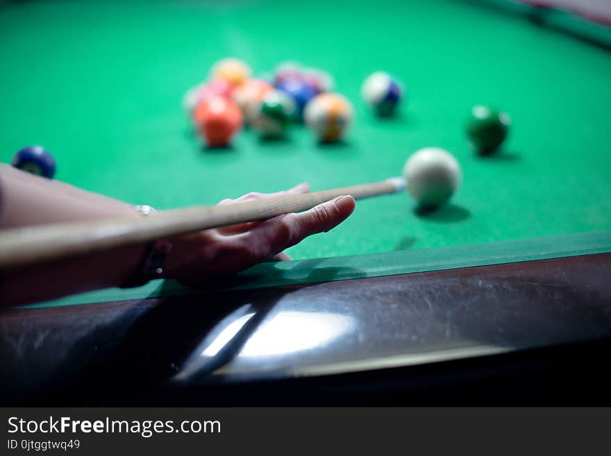 Woman hands playing pool