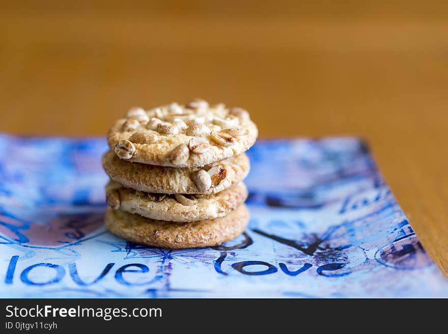 Cookies with peanuts on a blue plate. Cookies close-up. The inscription on the plates love.