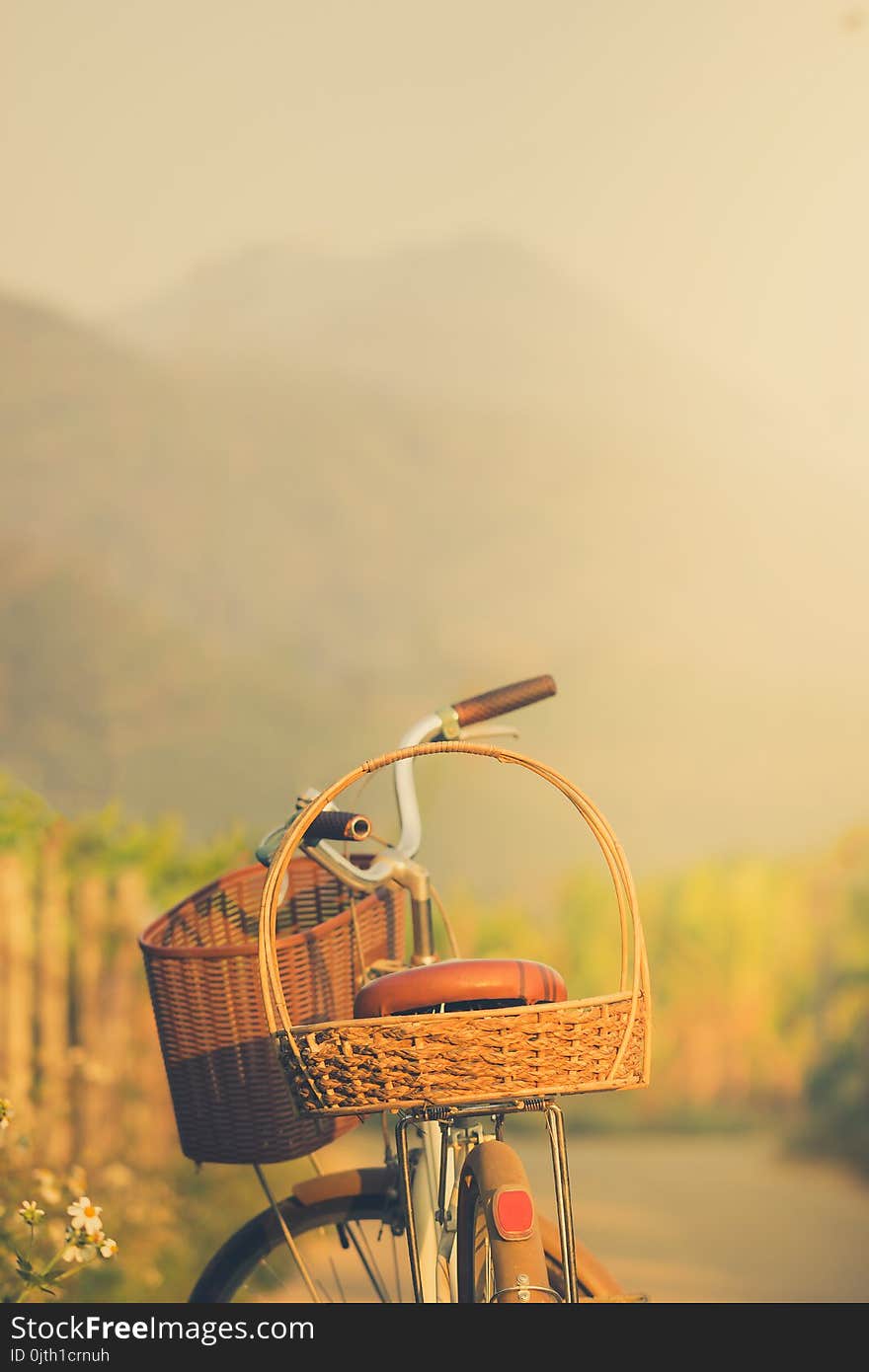 Bicycle on the side of the road way with mountains background. Copy space for text or article. Bicycle on the side of the road way with mountains background. Copy space for text or article.