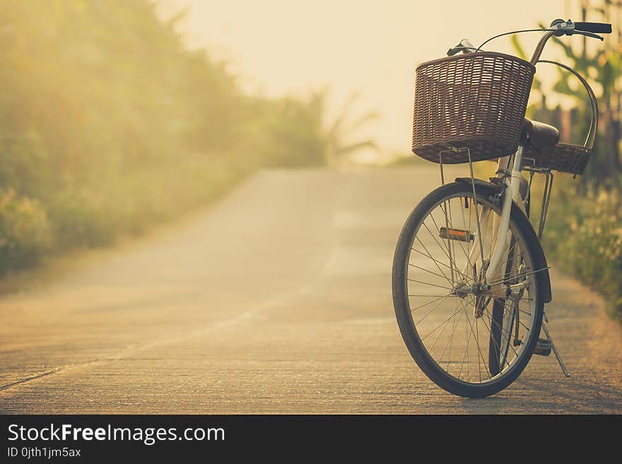 Bicycle on the side of the road way with mountains background. Copy space for text or article. Bicycle on the side of the road way with mountains background. Copy space for text or article.