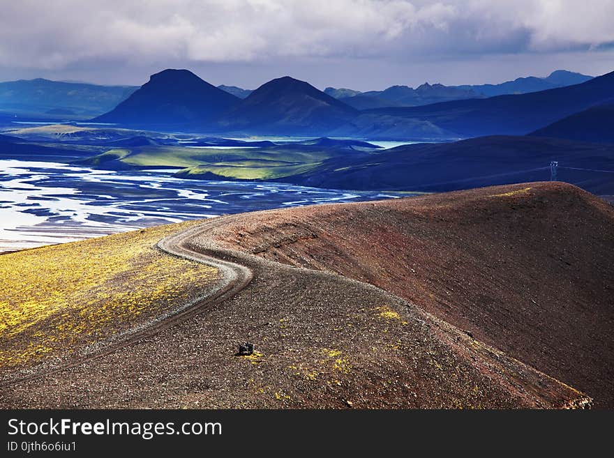 Beautiful Icelandic landscape. Green volcanic mountains in cloudy weather. Beautiful Icelandic landscape. Green volcanic mountains in cloudy weather.