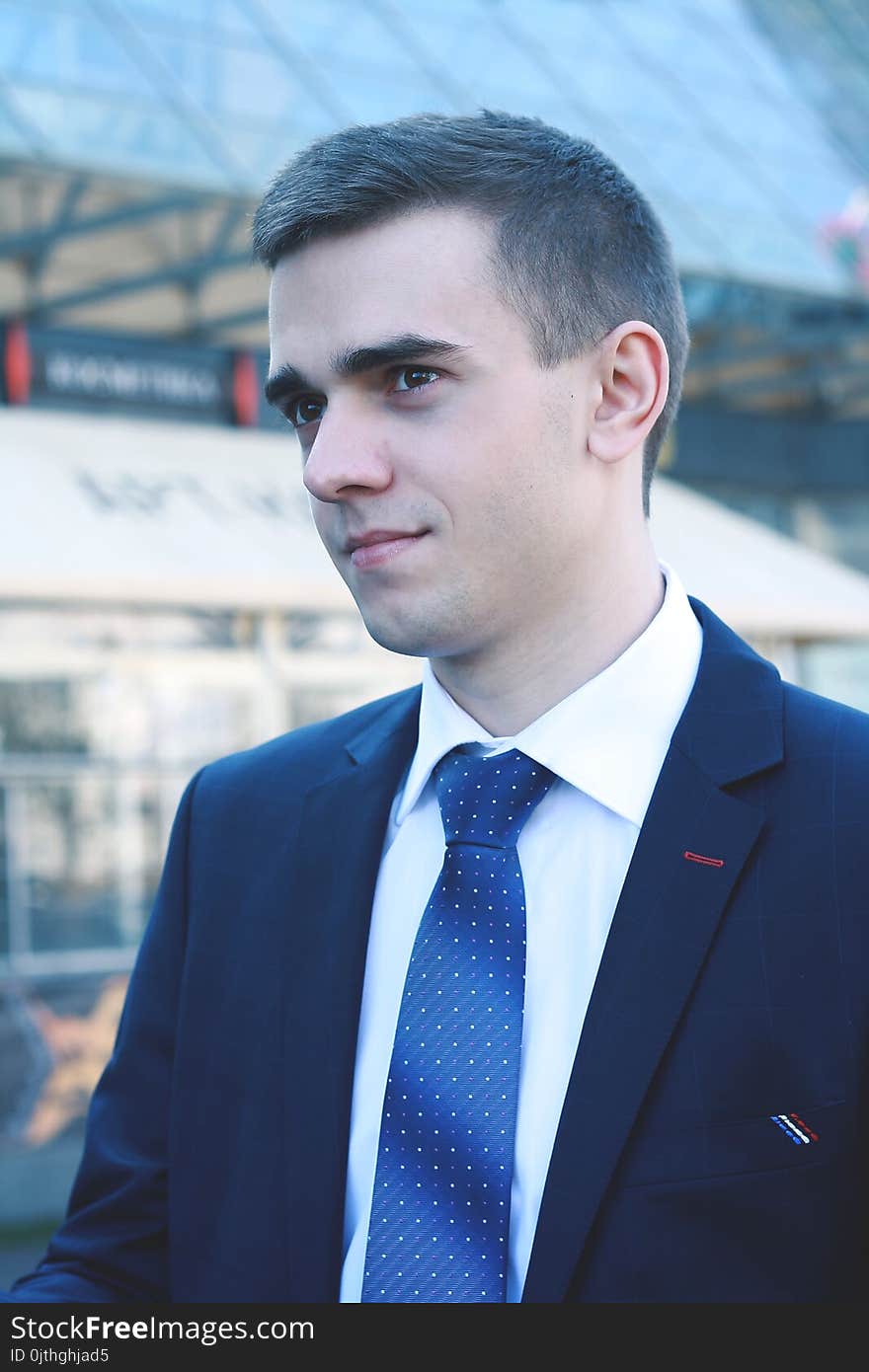 Close up.young businessman on background of office building