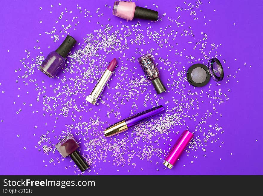 Make up purple on an ultra purple background with sparkles. Flat