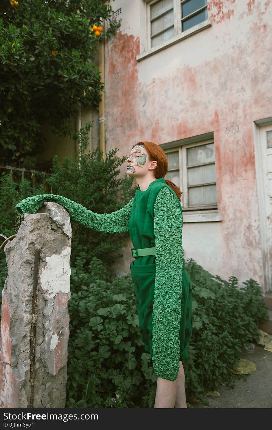 Woman Wearing Green Long-sleeved Costume With Face Paint