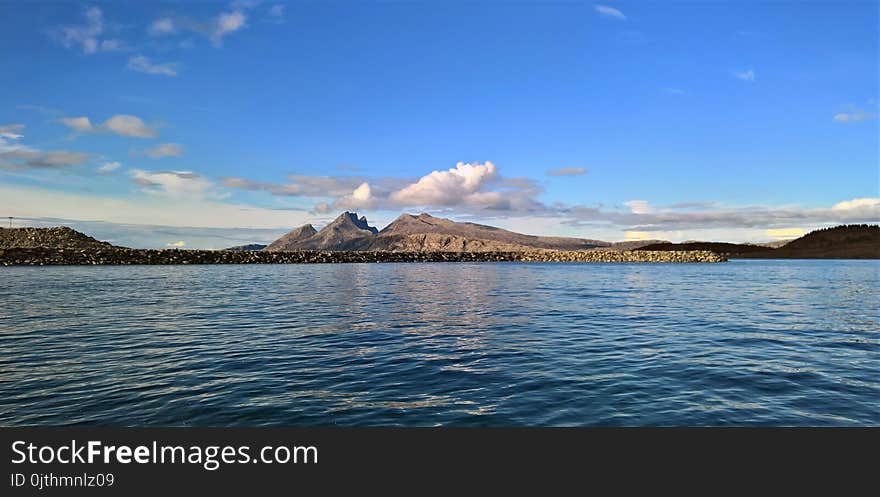 Landscape Photography of Mountain Near Body of Water