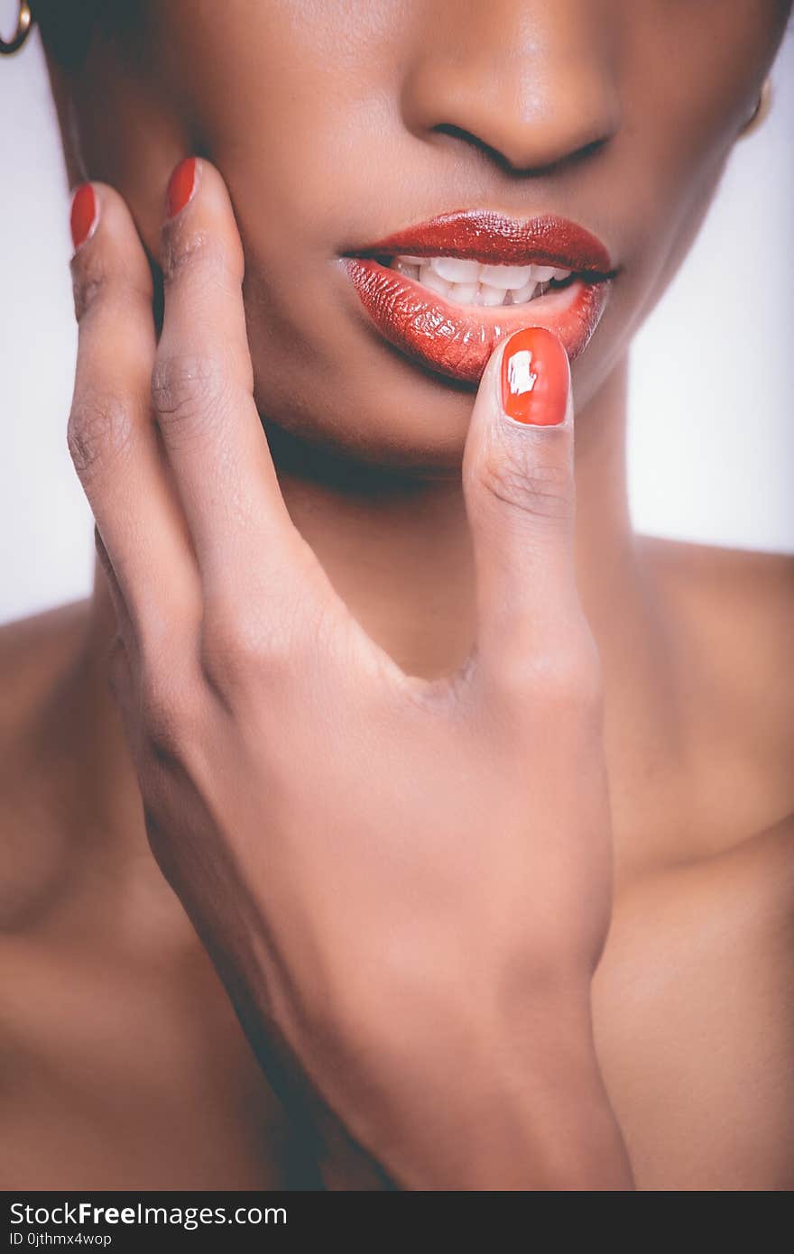 Woman With Red Lipstick and Red Manicure