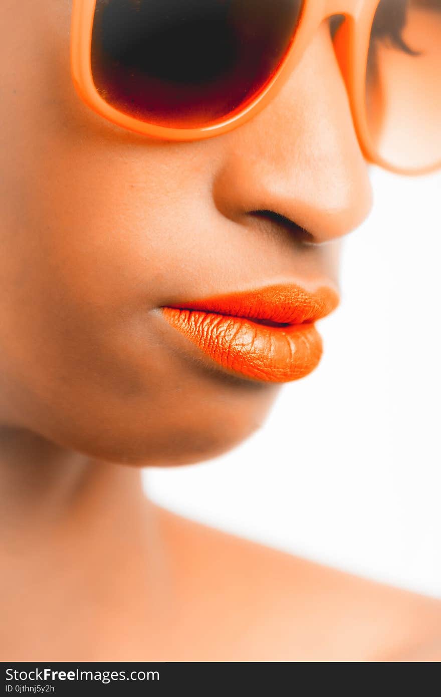 Woman Wearing Orange-framed Sunglasses and Orange Lipstick