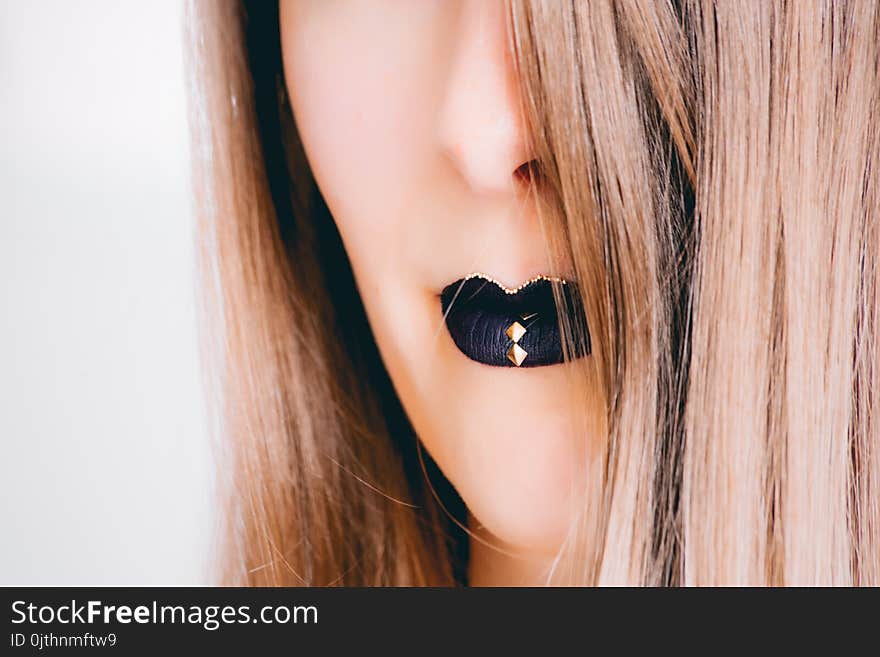 Close-up Photograph of Woman Wearing Black Lipstick