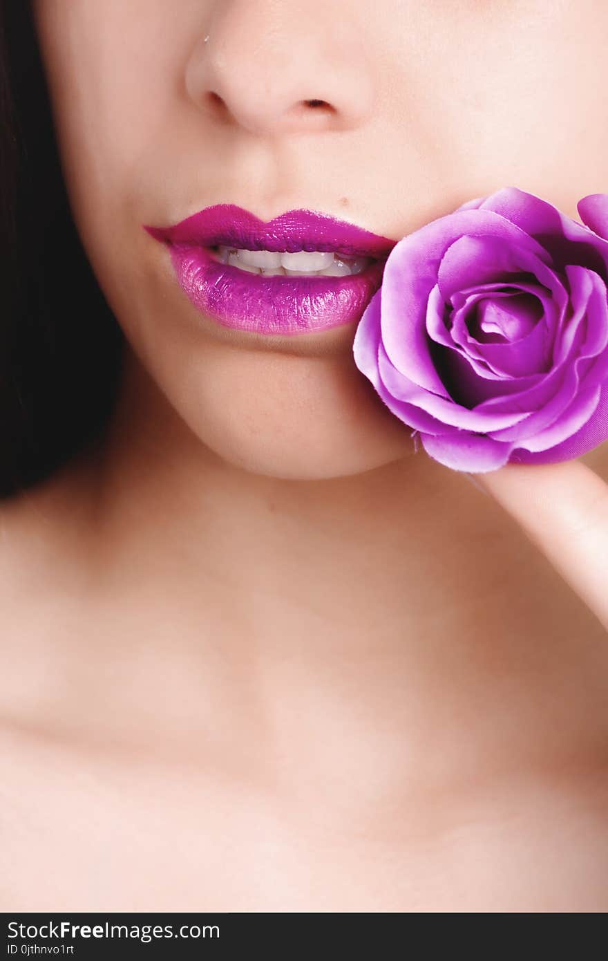 Woman With Pink Lipstick Holding Pink Rose